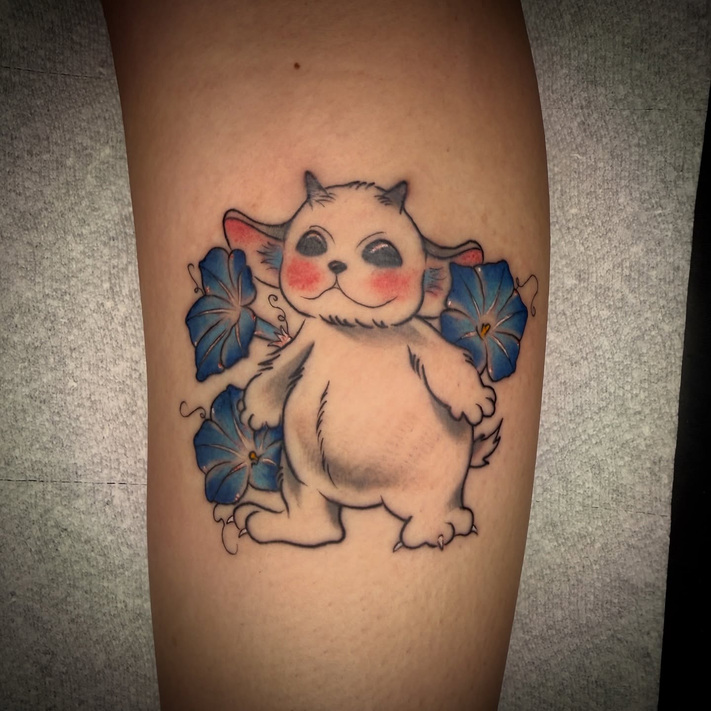 Cat with flowers new school tattoo on the thigh by Tattoo & Body Artist, Gastonia, North Carolina
