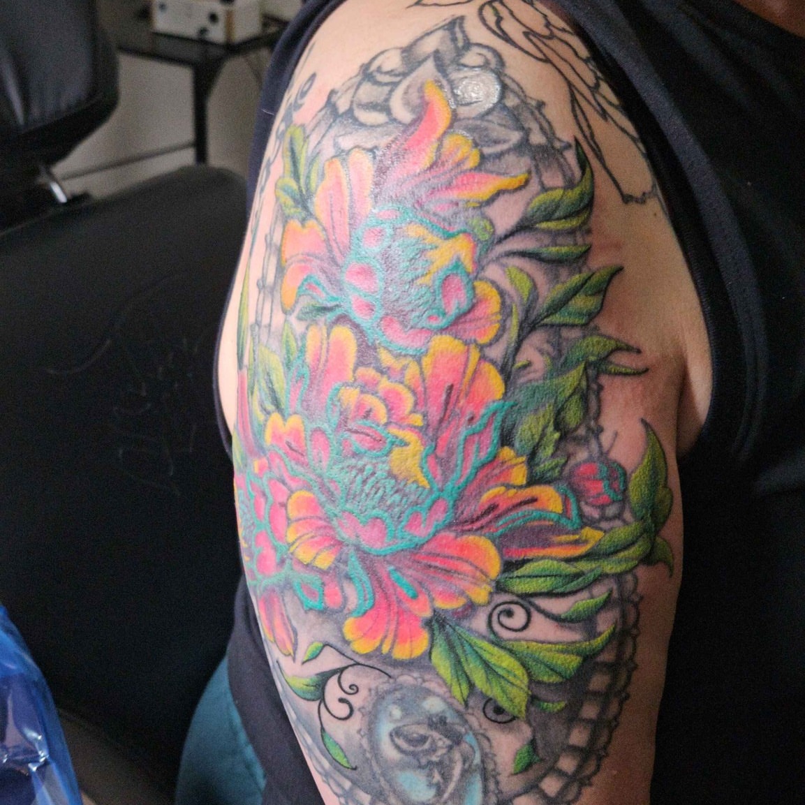 Floral bouquet new school tattoo on the shoulder by Iram Withencroft