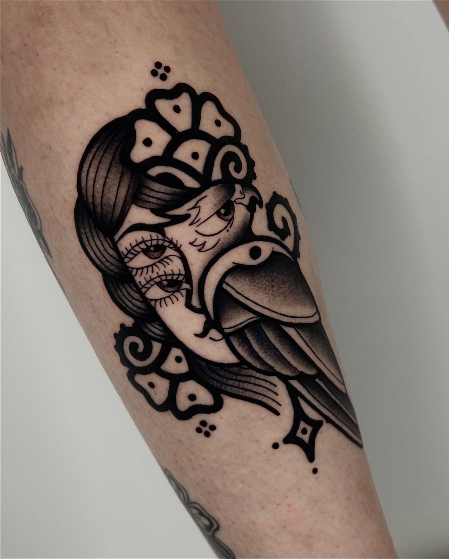 Raven and woman American traditional tattoo on the forearm by Rebel milly Tattoo