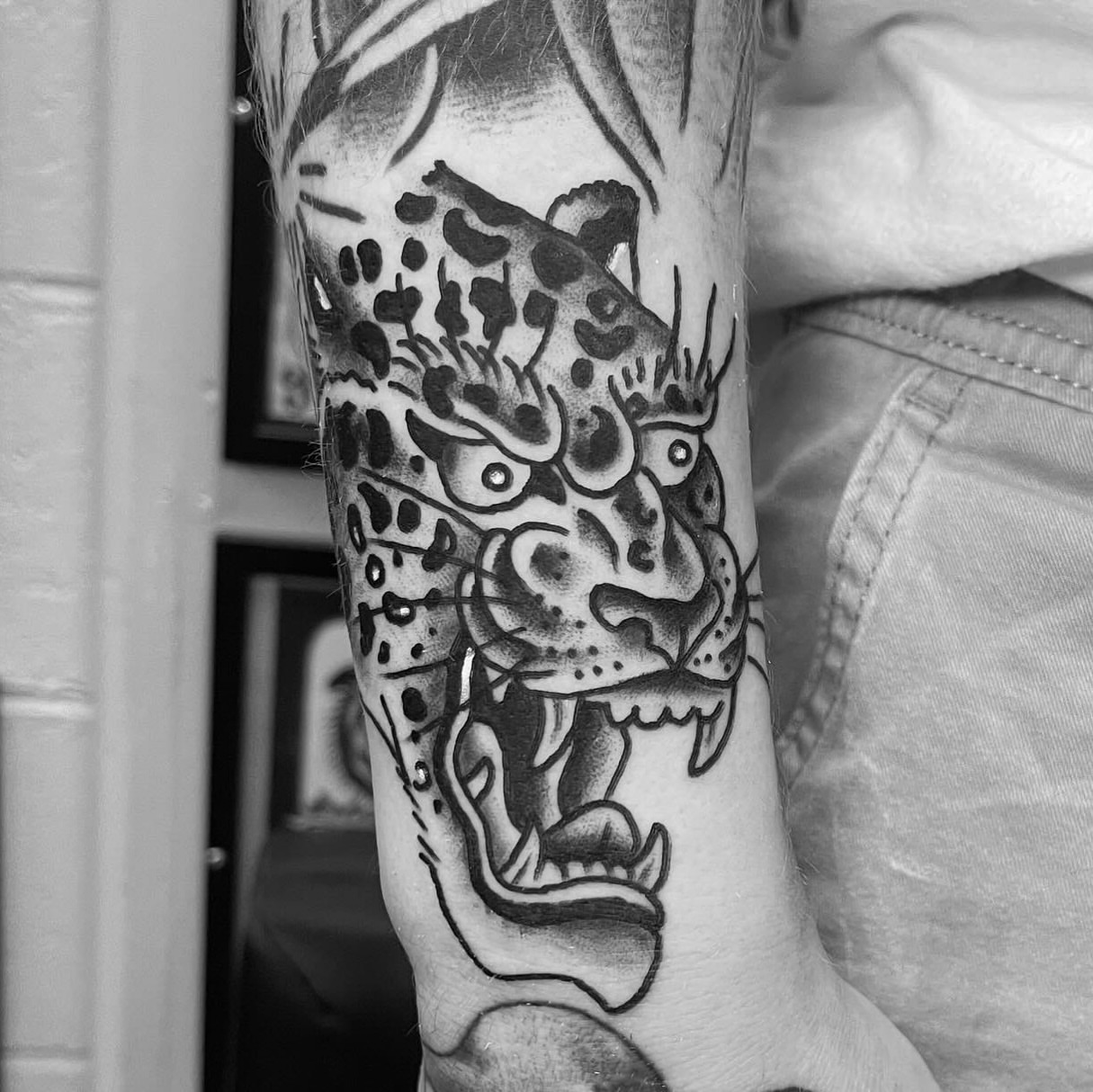 Jaguar black and grey tattoo on the forearm by adamsayre, San Diego, California