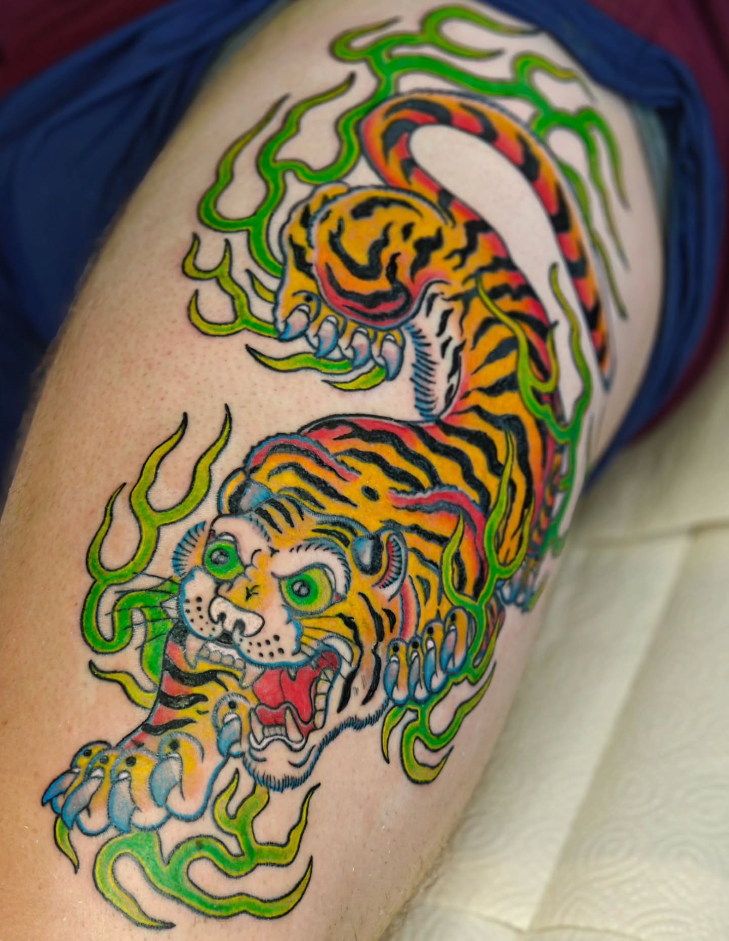 Tiger American traditional tattoo on the thigh by Tattoos by Reed Blount