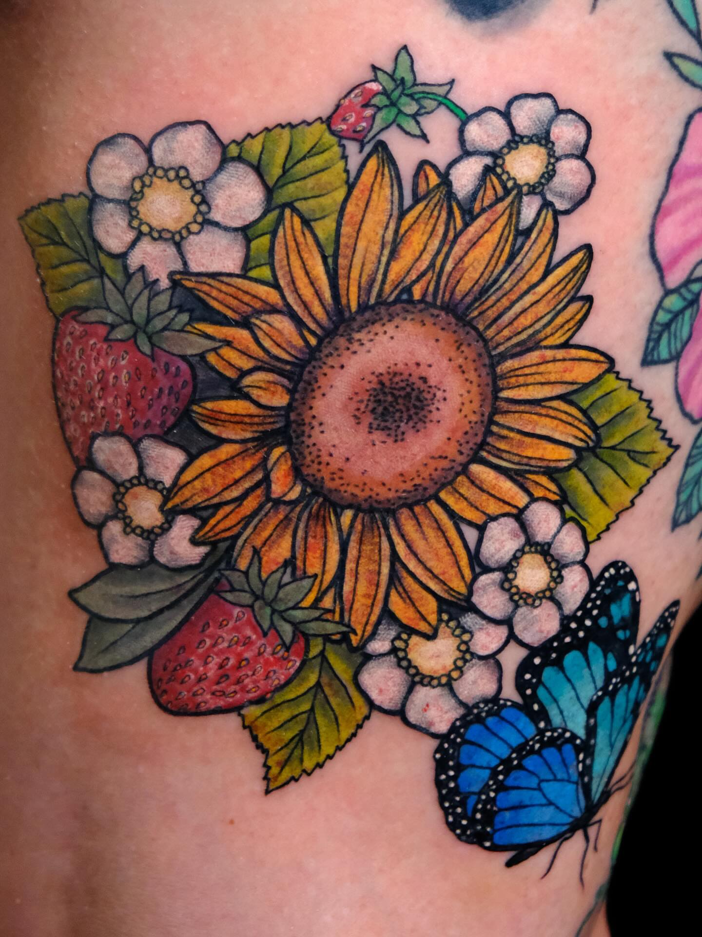 Sunflower bouquet dotwork tattoo on the thigh by Suzanne B