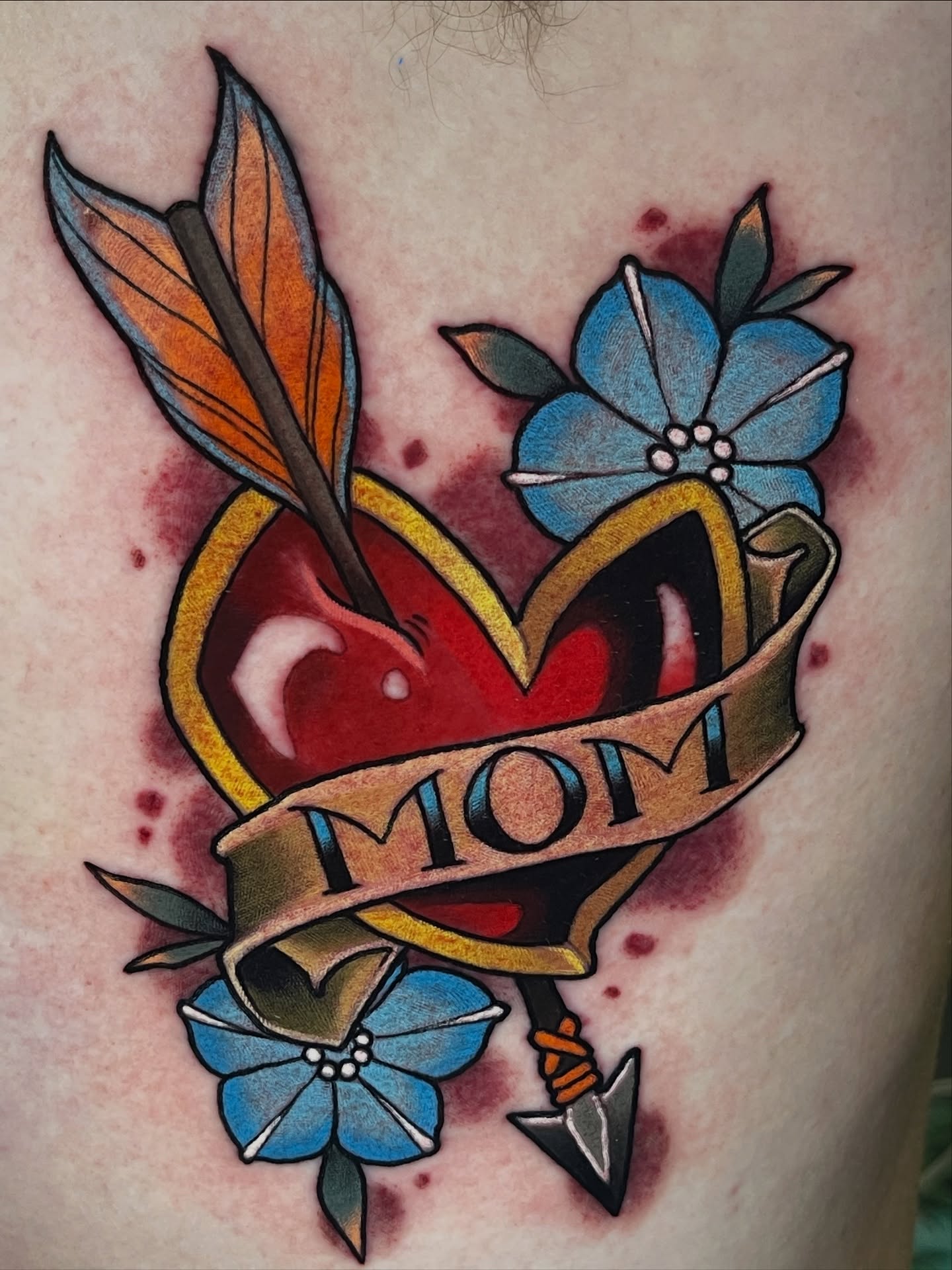 Heart with arrow American traditional tattoo on the thigh by Willy Cutlip
