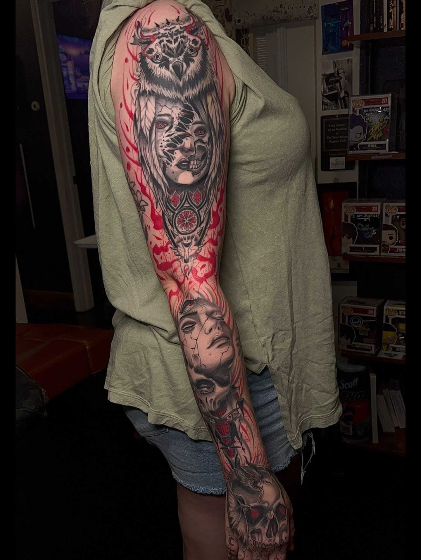 Owl and skull neo-traditional tattoo on the upper arm by Denis Seregin