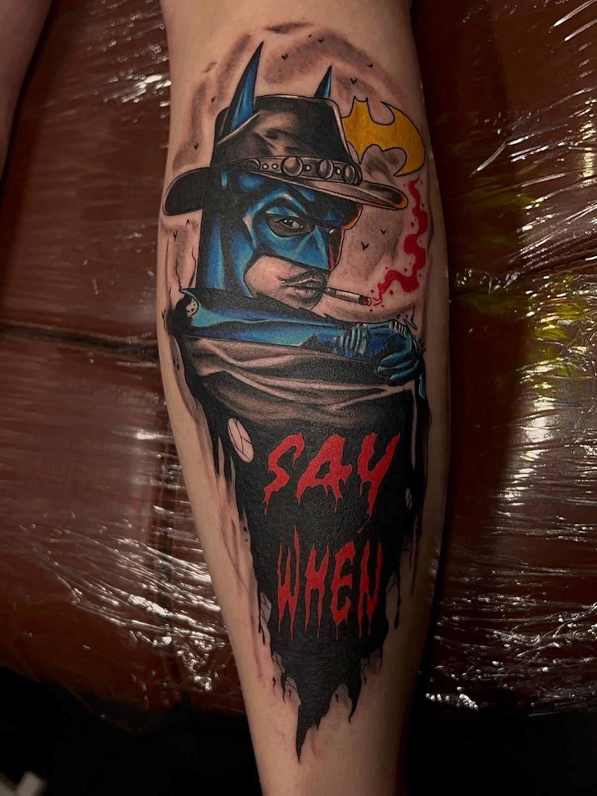 Batman dark realism tattoo on the forearm by Denis Seregin