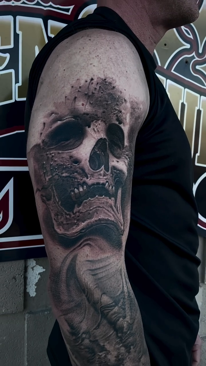 Skull with flowing elements dark realism tattoo by Robert Hernandez