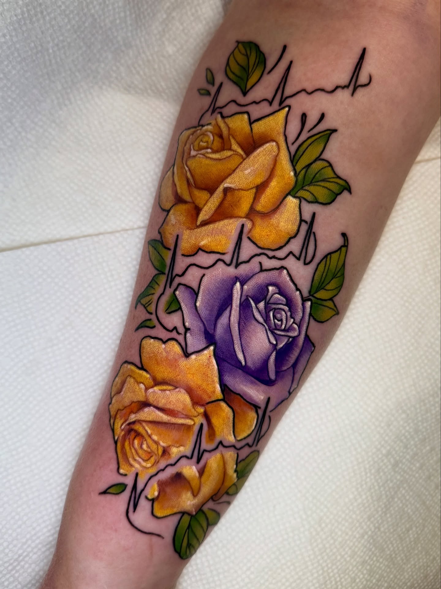 Roses American traditional tattoo on the forearm by Paul Endres Jr
