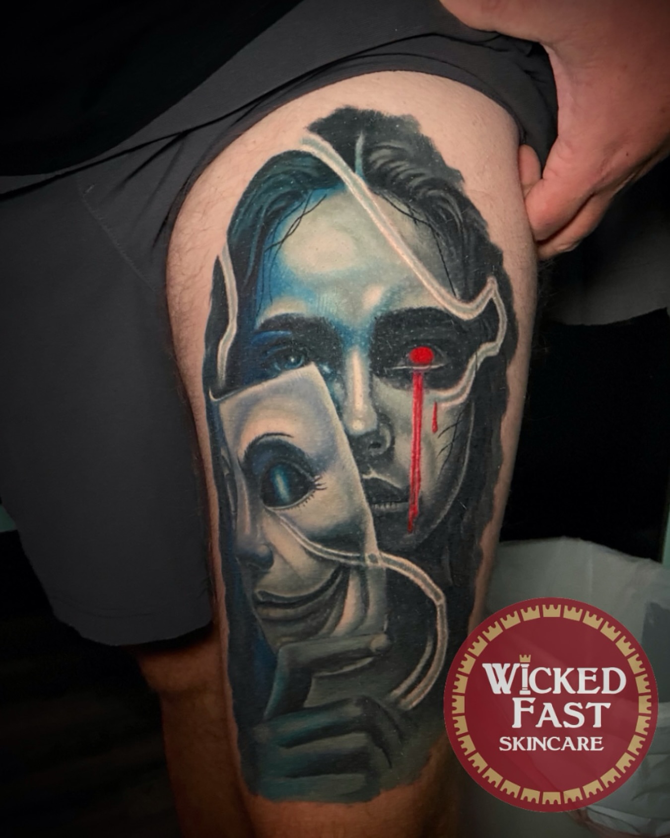 Mask with blood realism tattoo on the thigh by Brandon Bowie
