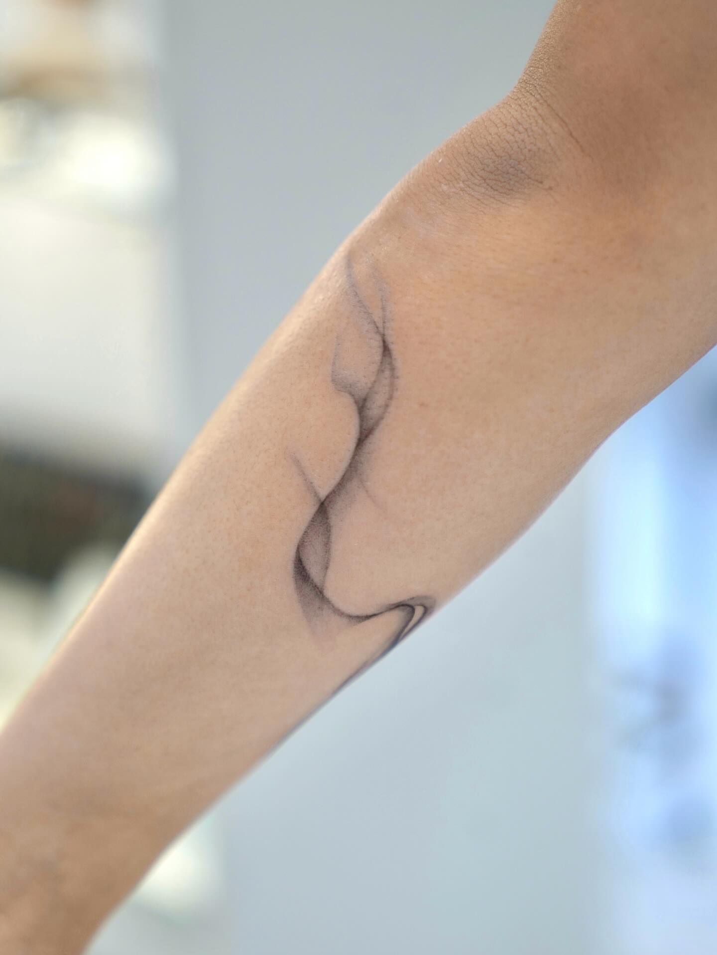 Abstract shape black and grey tattoo on the forearm by David H.