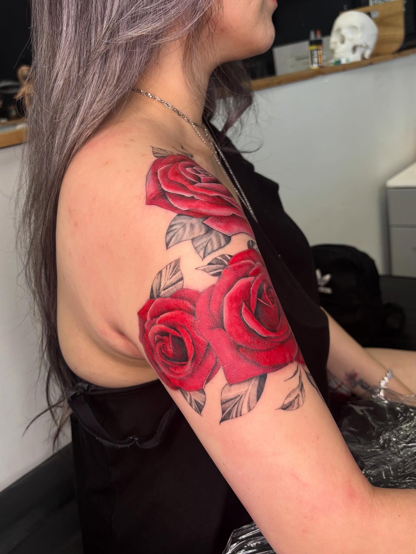 Red roses realism tattoo on the shoulder by Harley Lane ๐ซ