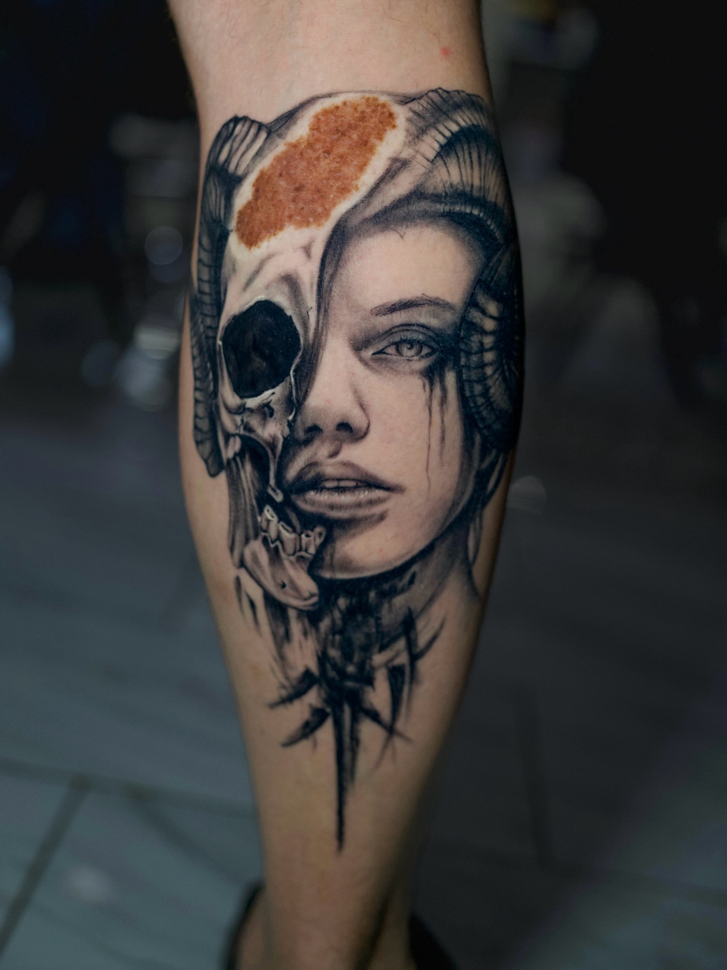 Woman with skull dark realism tattoo on the forearm by Charlotte Tattoo Artist