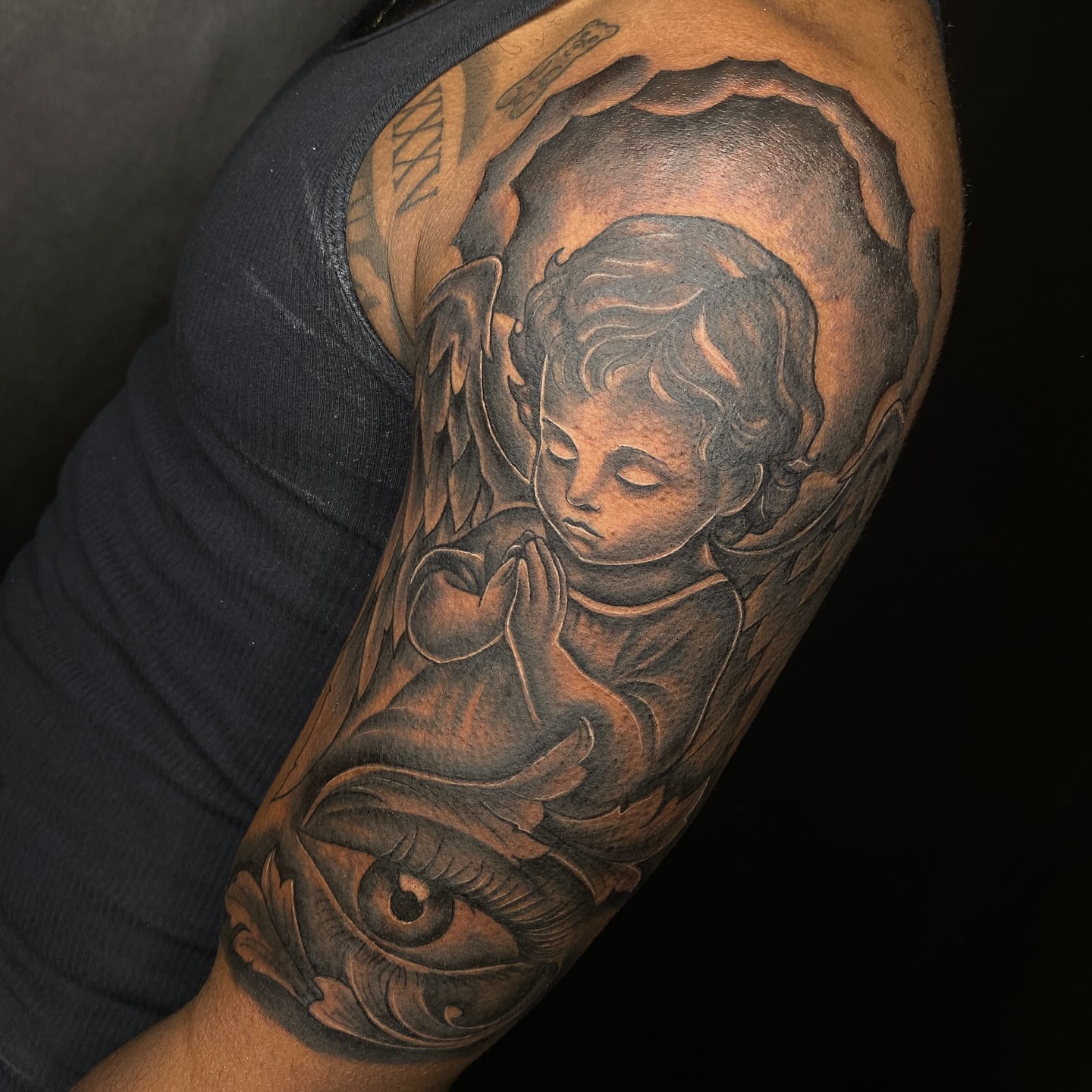 Praying angel realism tattoo on the forearm by Elijah East