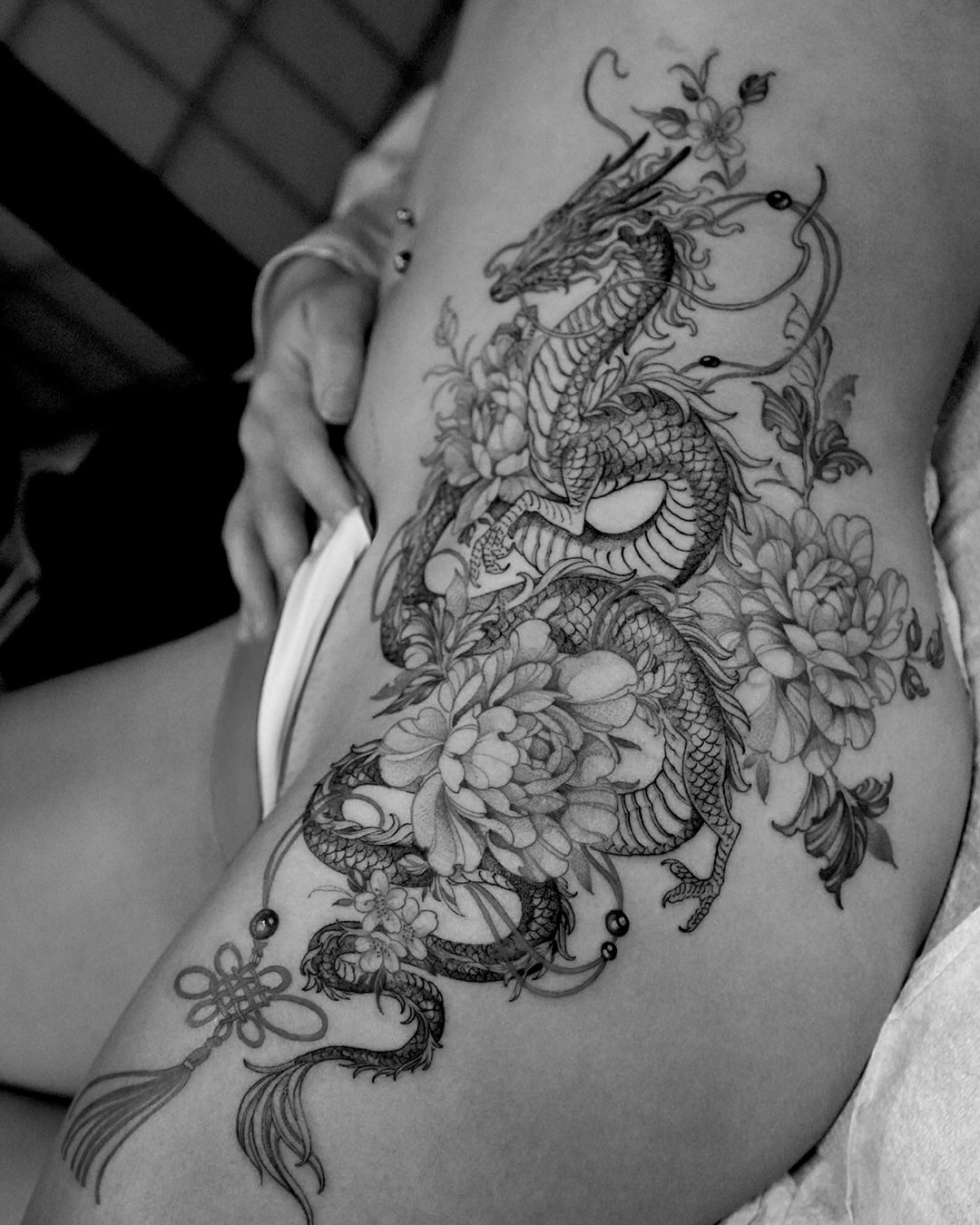 Dragon and flowers dotwork tattoo on the thigh by 🌛 Lê Huỳnh🌜, Dallas, Texas