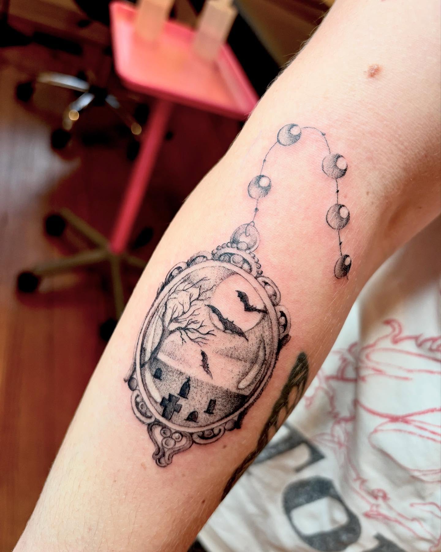 Clock and birds realism tattoo on the forearm by madison, Cincinnati