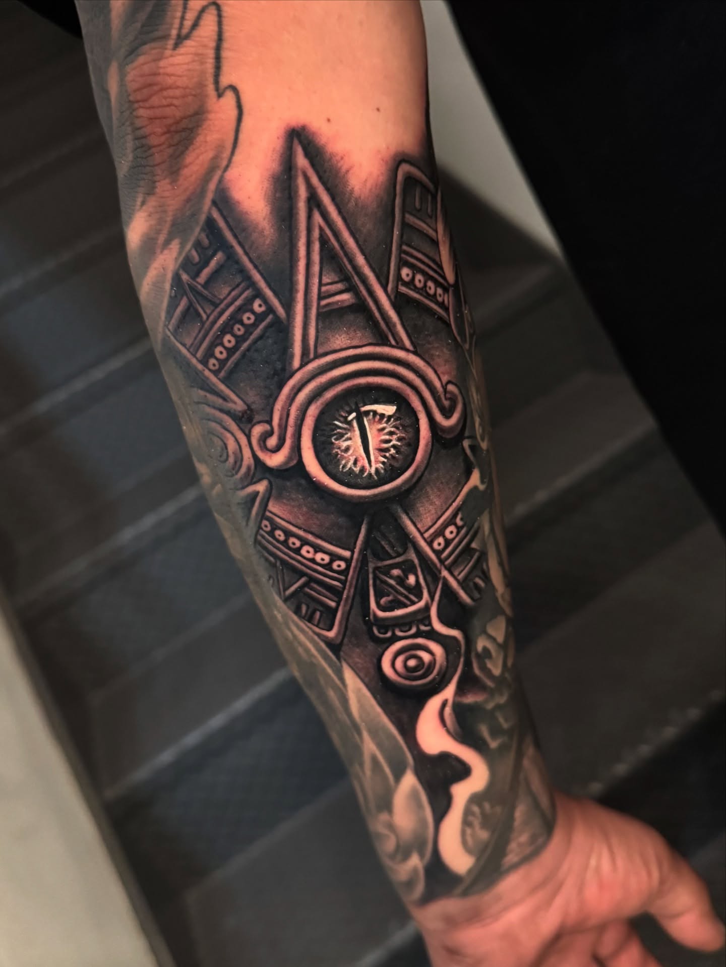 Geometric mask geometric tattoo on the forearm by Gabriel Quintana “Q”