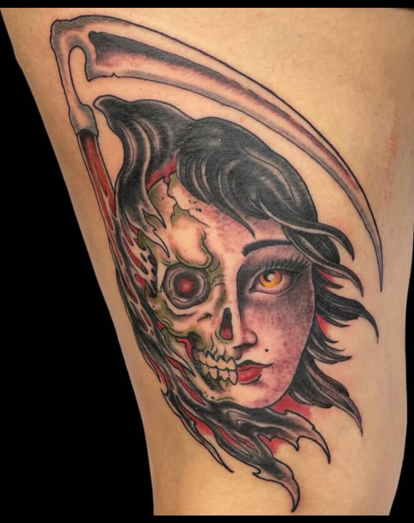 Skull and woman American traditional tattoo on the thigh by Waylon