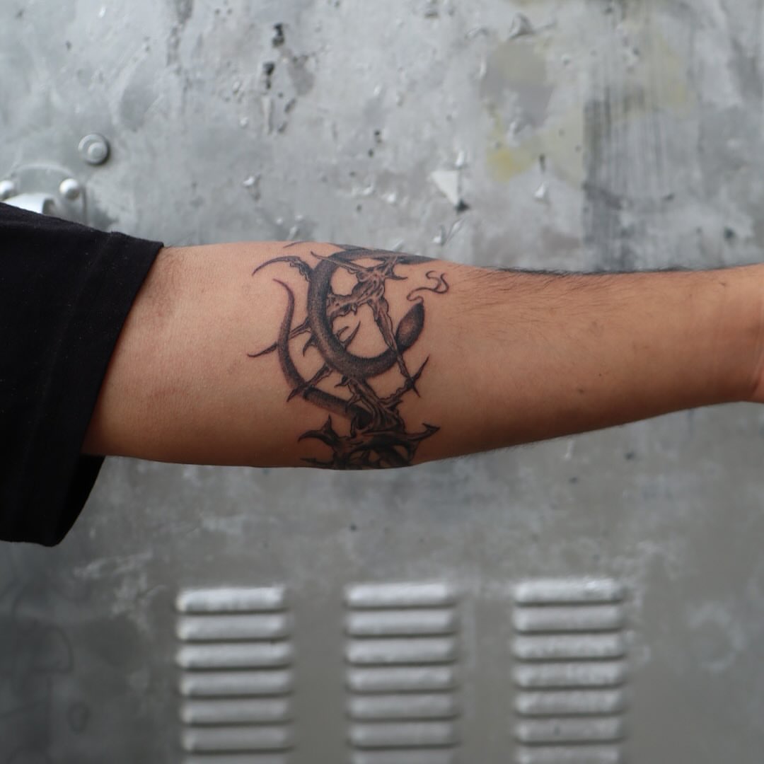 Thorned dragon black and grey tattoo on the forearm by Ladyjutsu
