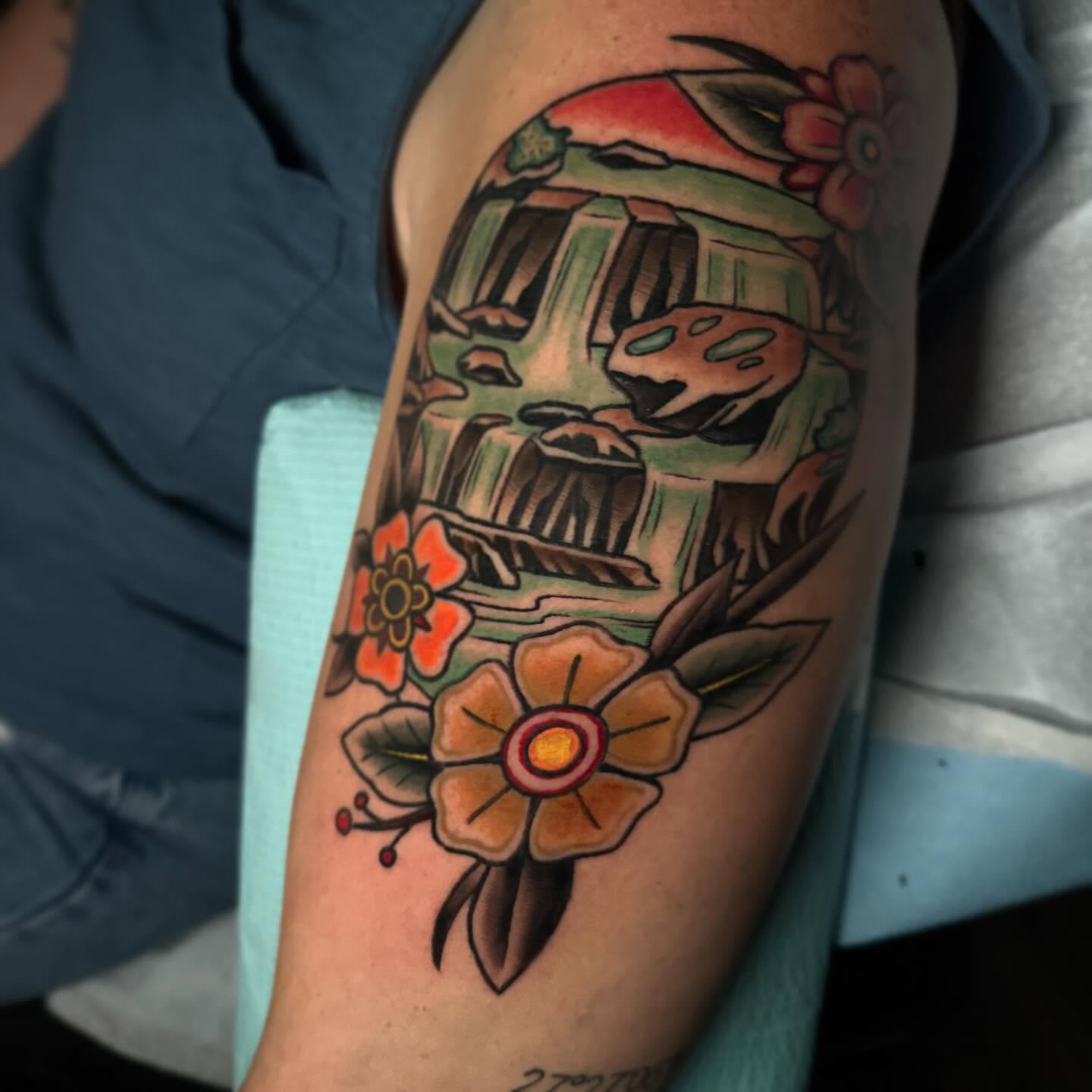 Train and flowers American traditional tattoo on the forearm by Alex Rockoff