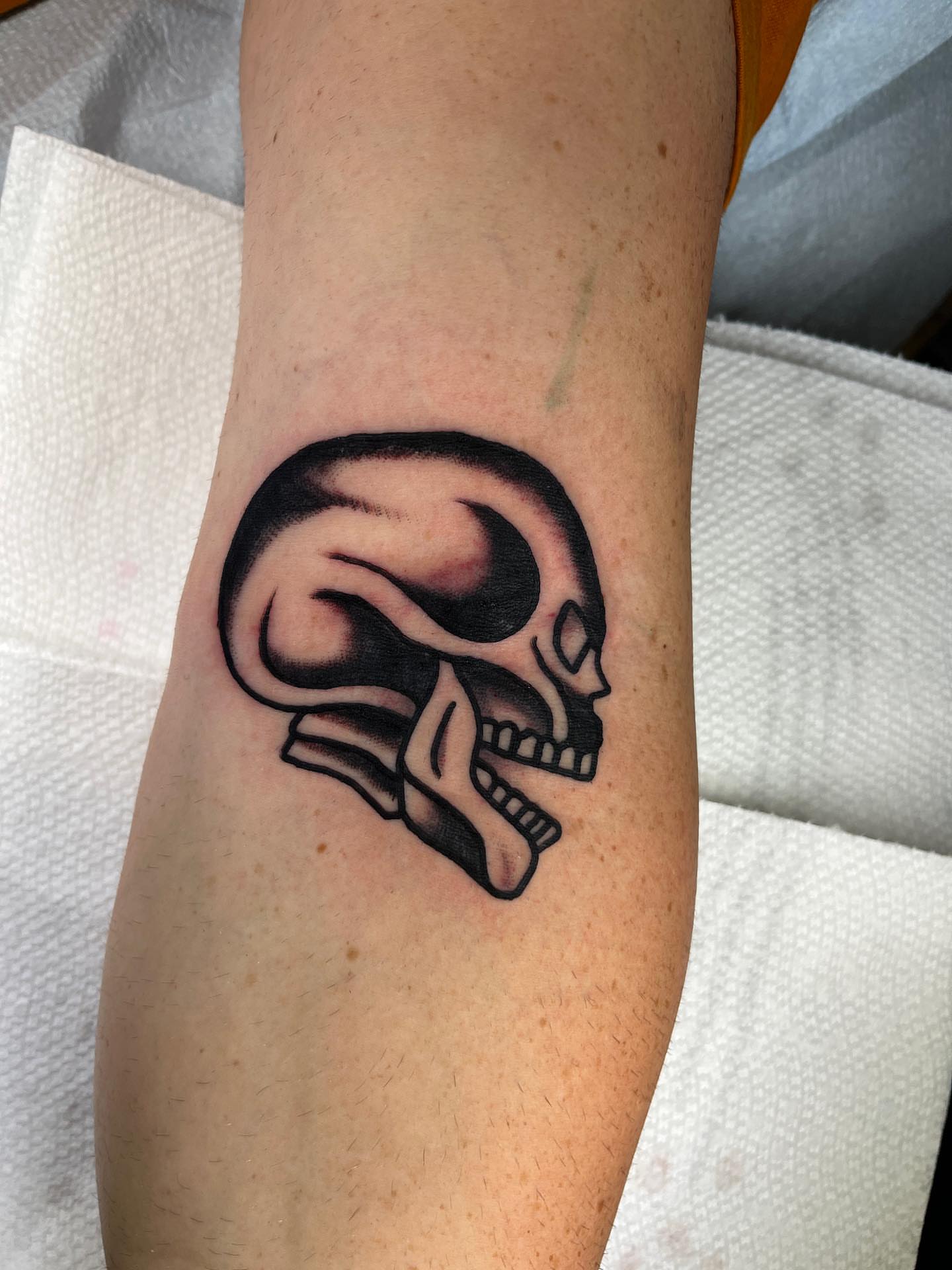 Skull black and grey tattoo on the forearm by Charlie Ostrom, Durham, North Carolina