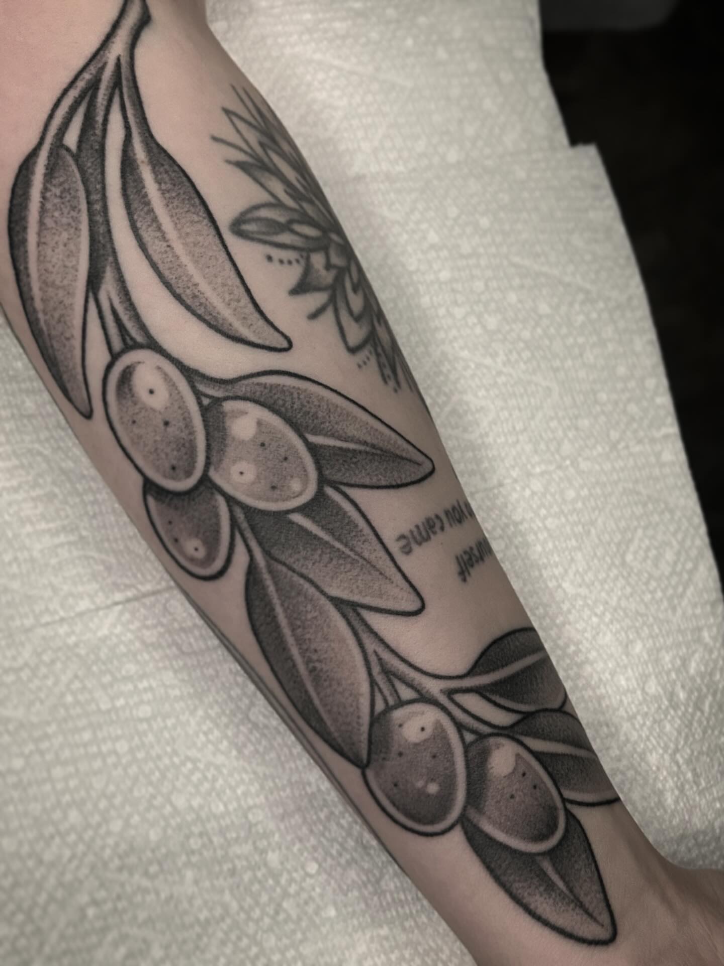 Olive branch dotwork tattoo on the forearm by Kayla Shoffner