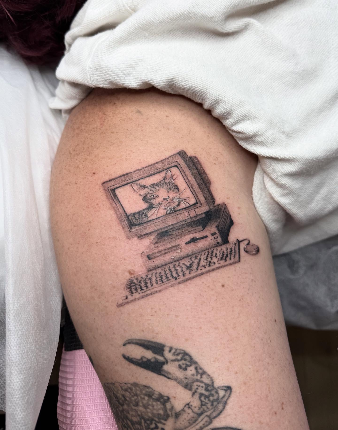 Computer monitor with cat black and grey tattoo on the upper arm by 🗡Addie Kat🗡