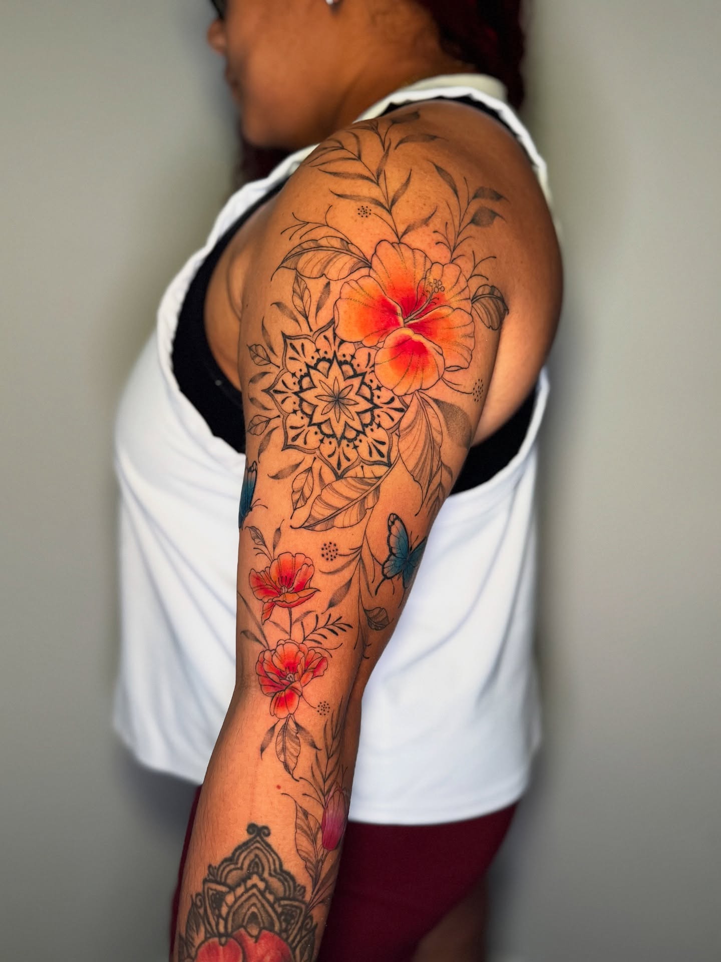 Floral mandala new school tattoo on the upper arm by 𝕹𝖆𝖙
