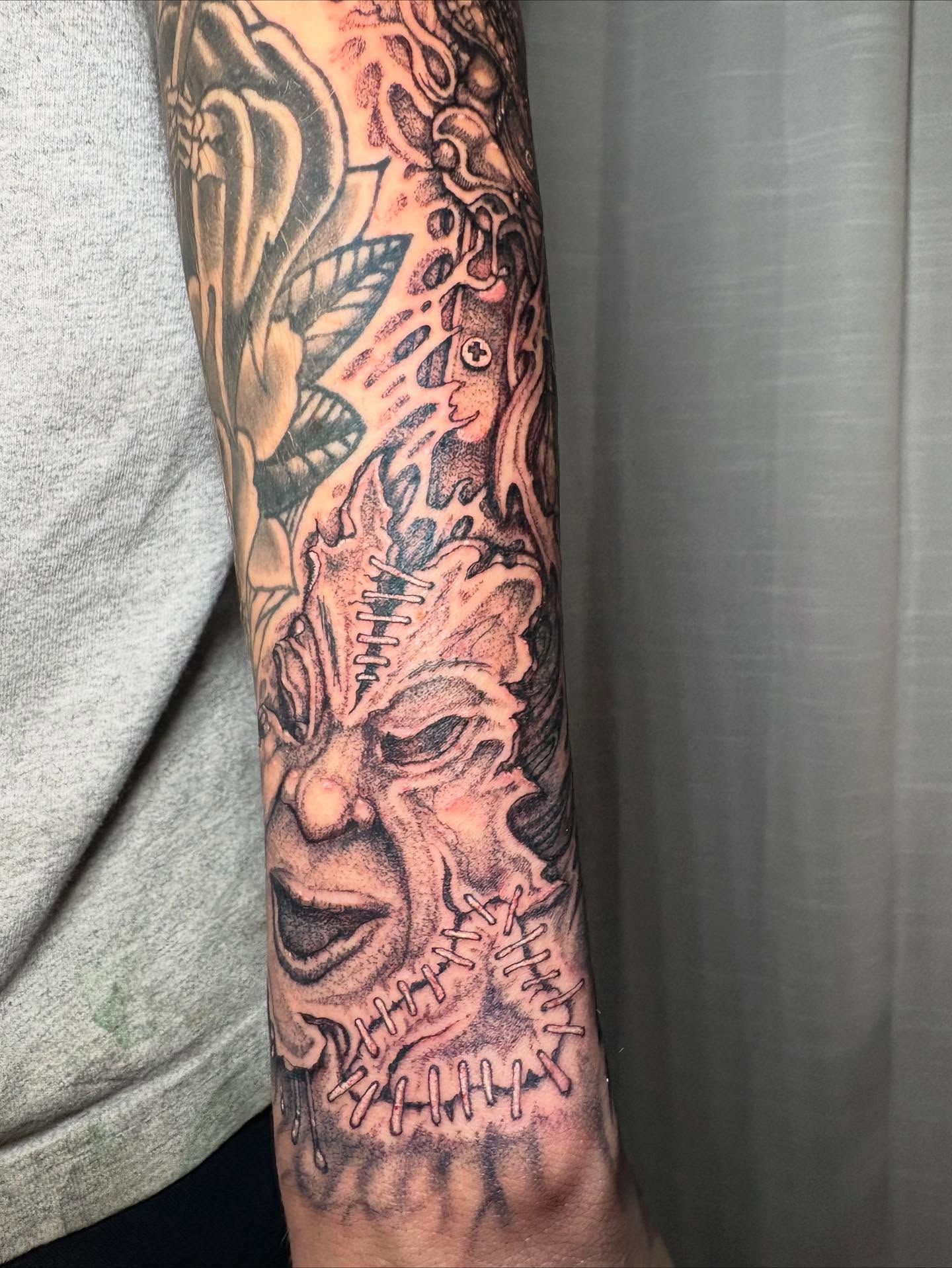 Skull dark realism tattoo on the forearm by Brendan Smith