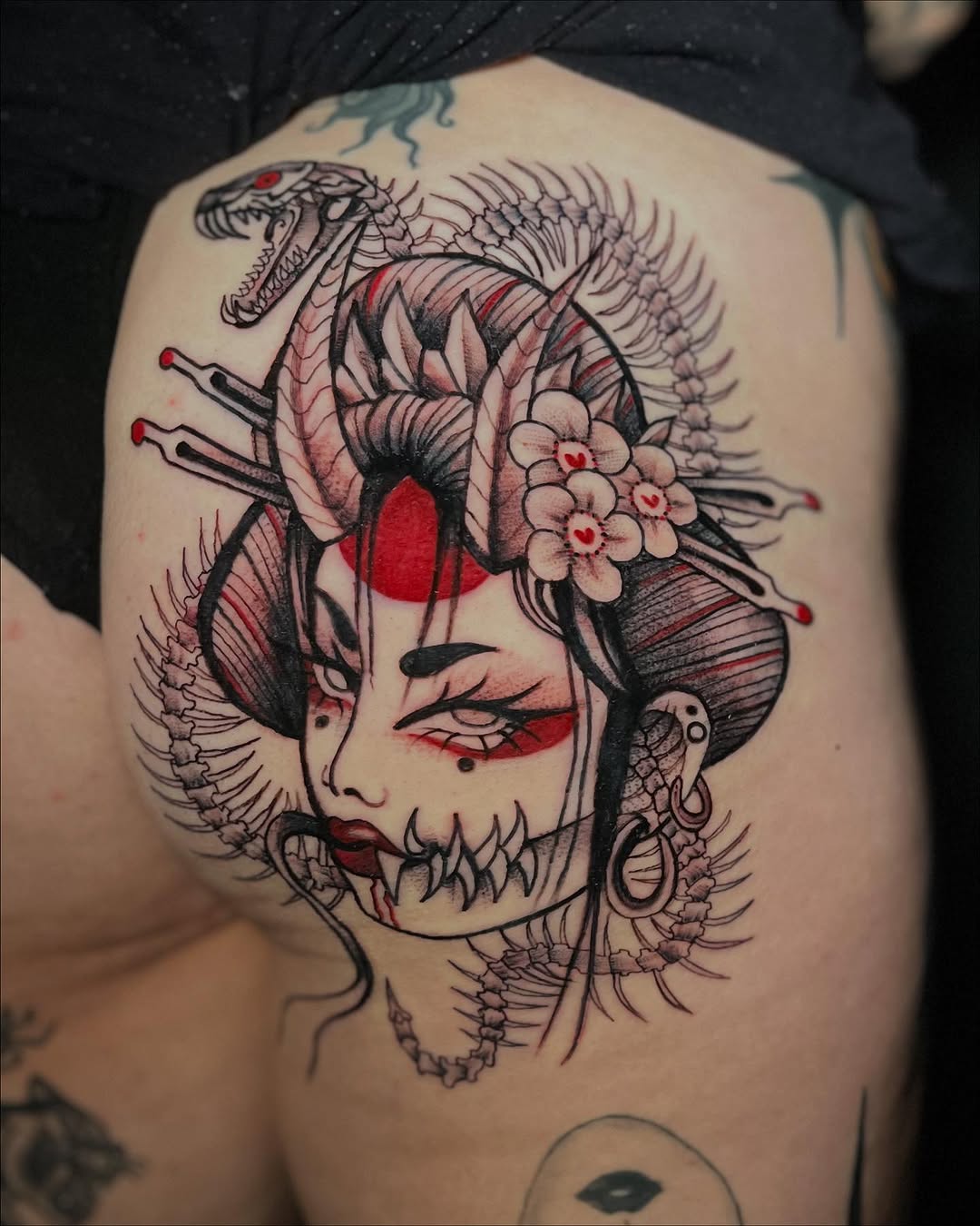 Geisha with snake and skeleton elements realism tattoo on the thigh by Sasha “Sashimi” Shabasov