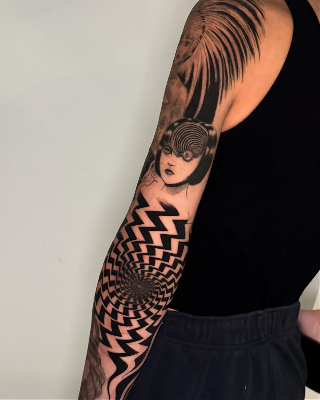 Surrealism tattoo on the forearm by Erin Blaney