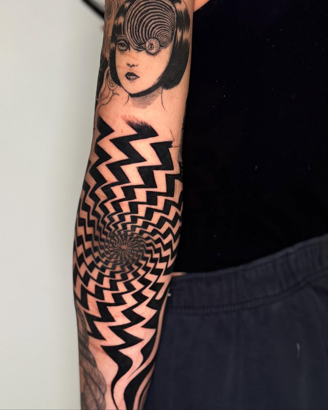 Surrealism tattoo on the forearm by Erin Blaney