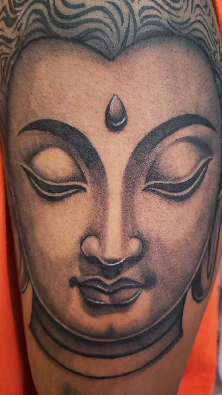 Buddha portrait realism tattoo by professional tattoo artist
