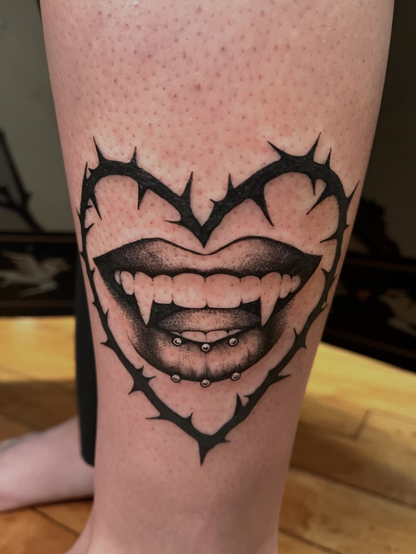 Fangs and thorns realism tattoo on the forearm by Zoe Phan, Richmond, Virginia