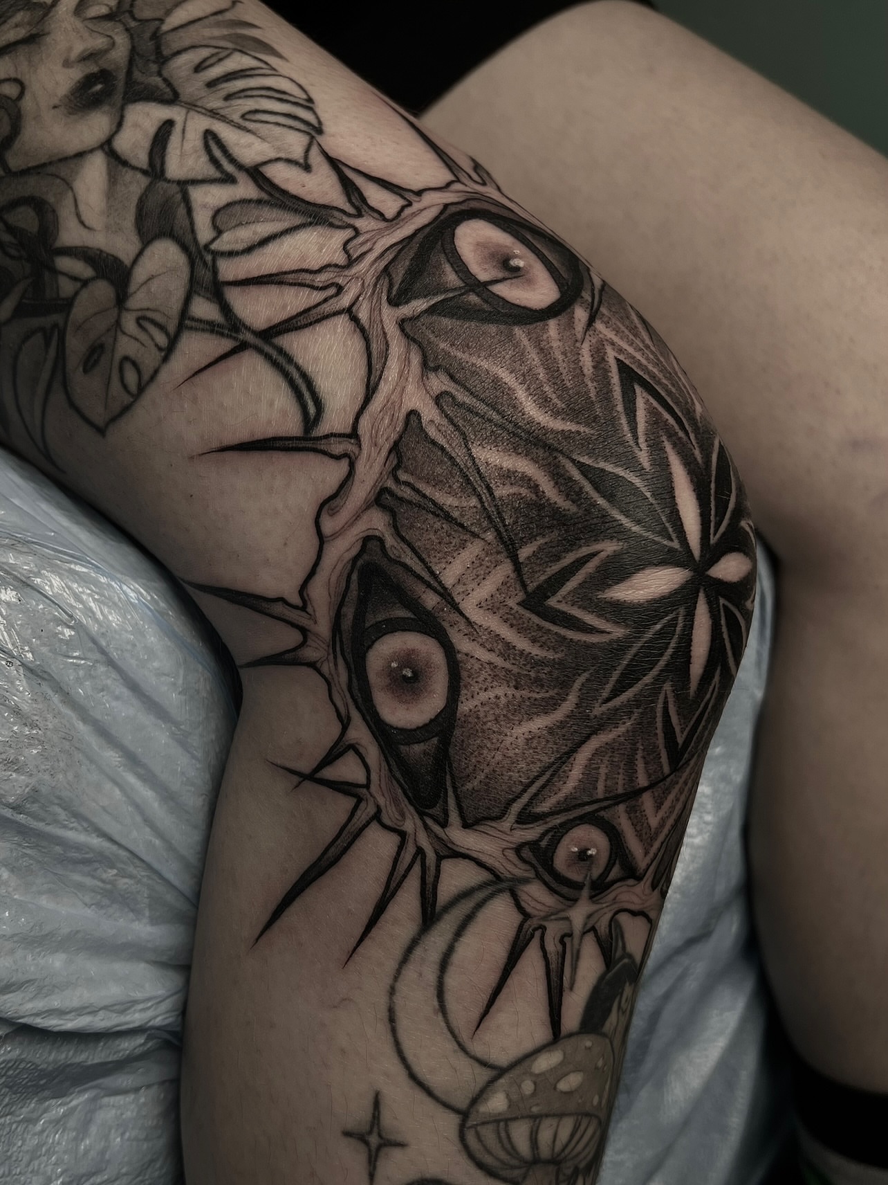 Eye and plant geometric tattoo on the thigh by ༒ boniandi༒