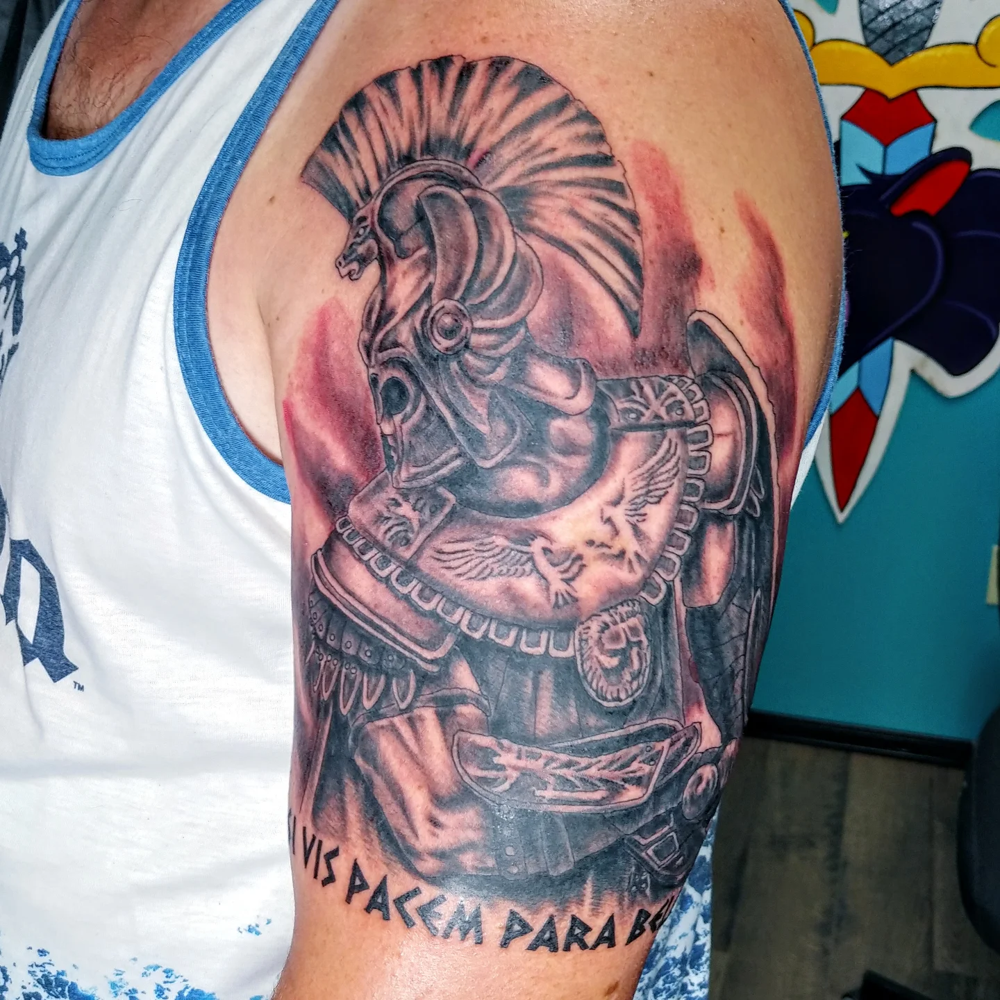 Warrior helmet black and grey tattoo on the forearm by Reb Fularz