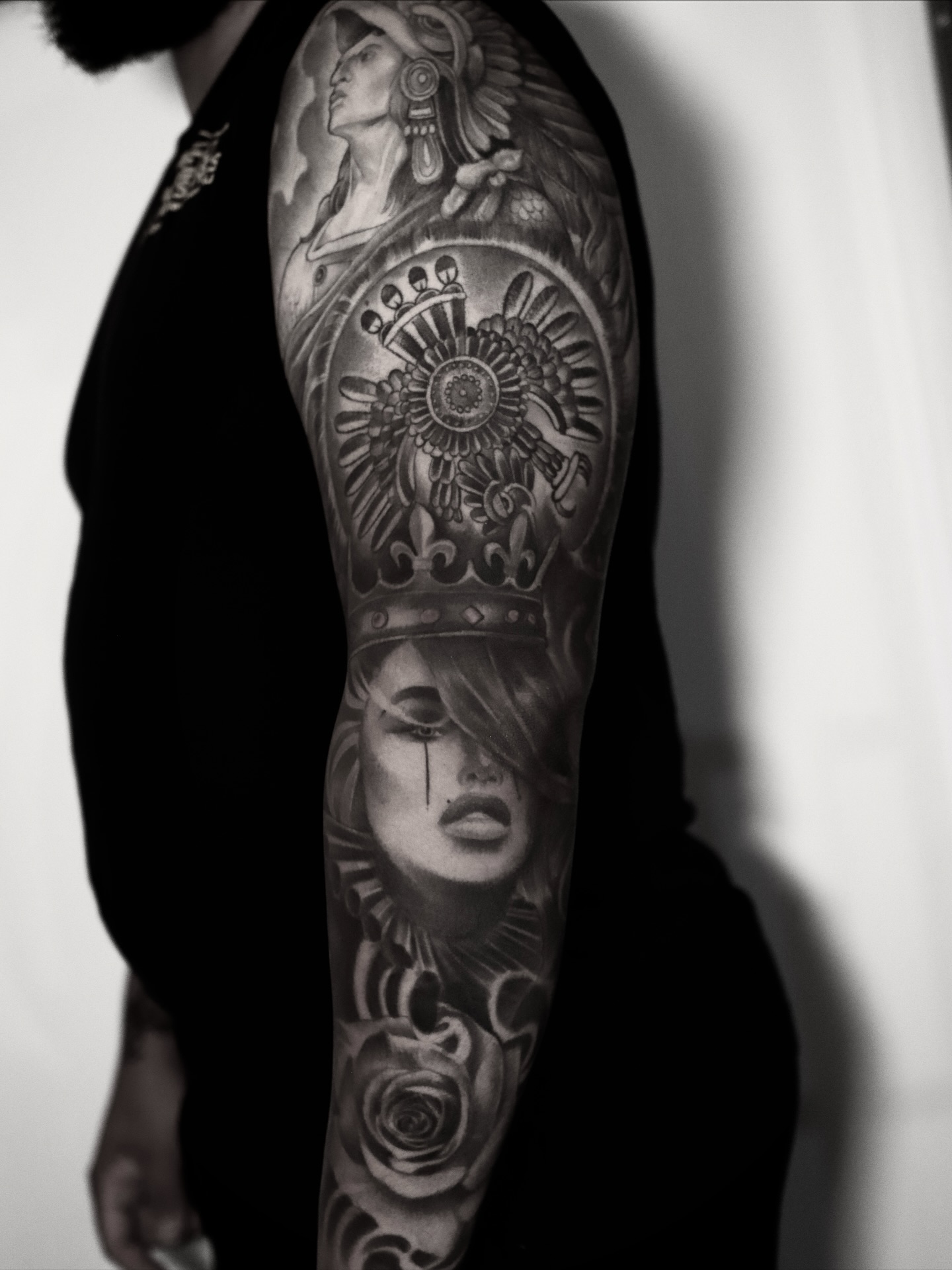 Woman and Aztec calendar realism tattoo on the forearm by elvis flores