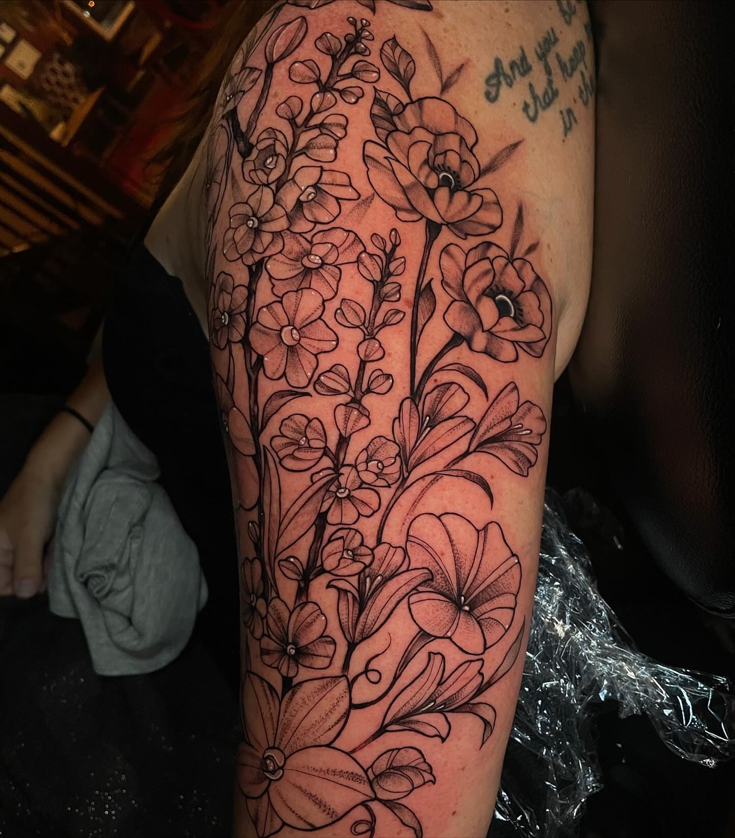 Floral bouquet black and grey tattoo on the forearm by Lauren Sisouphanh, Canton, Ohio