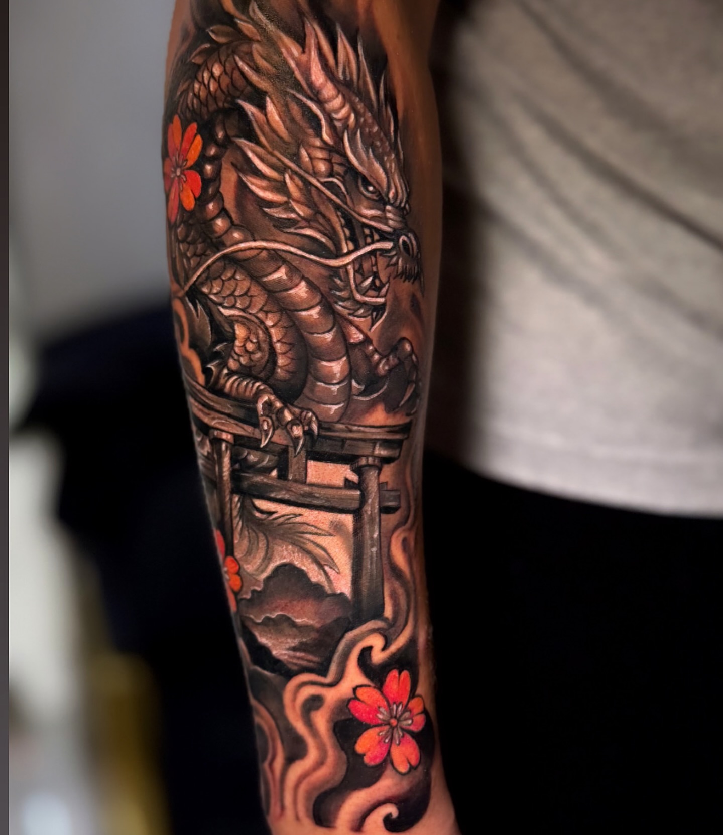Dragon and cherry blossoms japanese irezumi tattoo on the forearm by Eyinay Cabezas 🇨🇺🇺🇸
