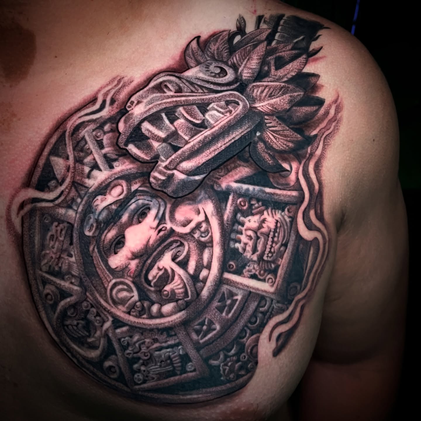 Mayan calendar geometric tattoo on the chest by Chato