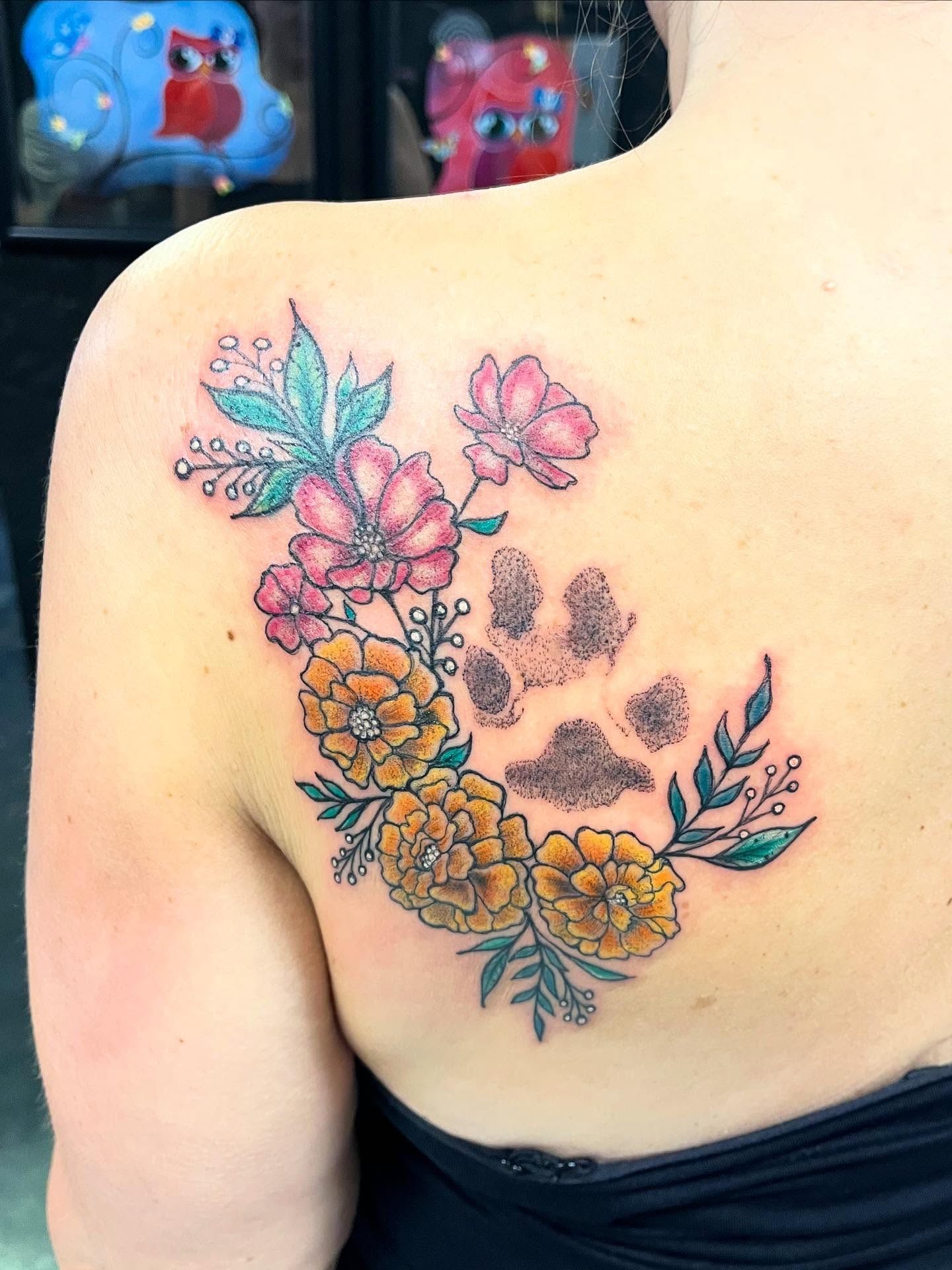 Floral arrangement with paw print dotwork tattoo on the shoulder by Vegas Val LadyTattooArtist 💚