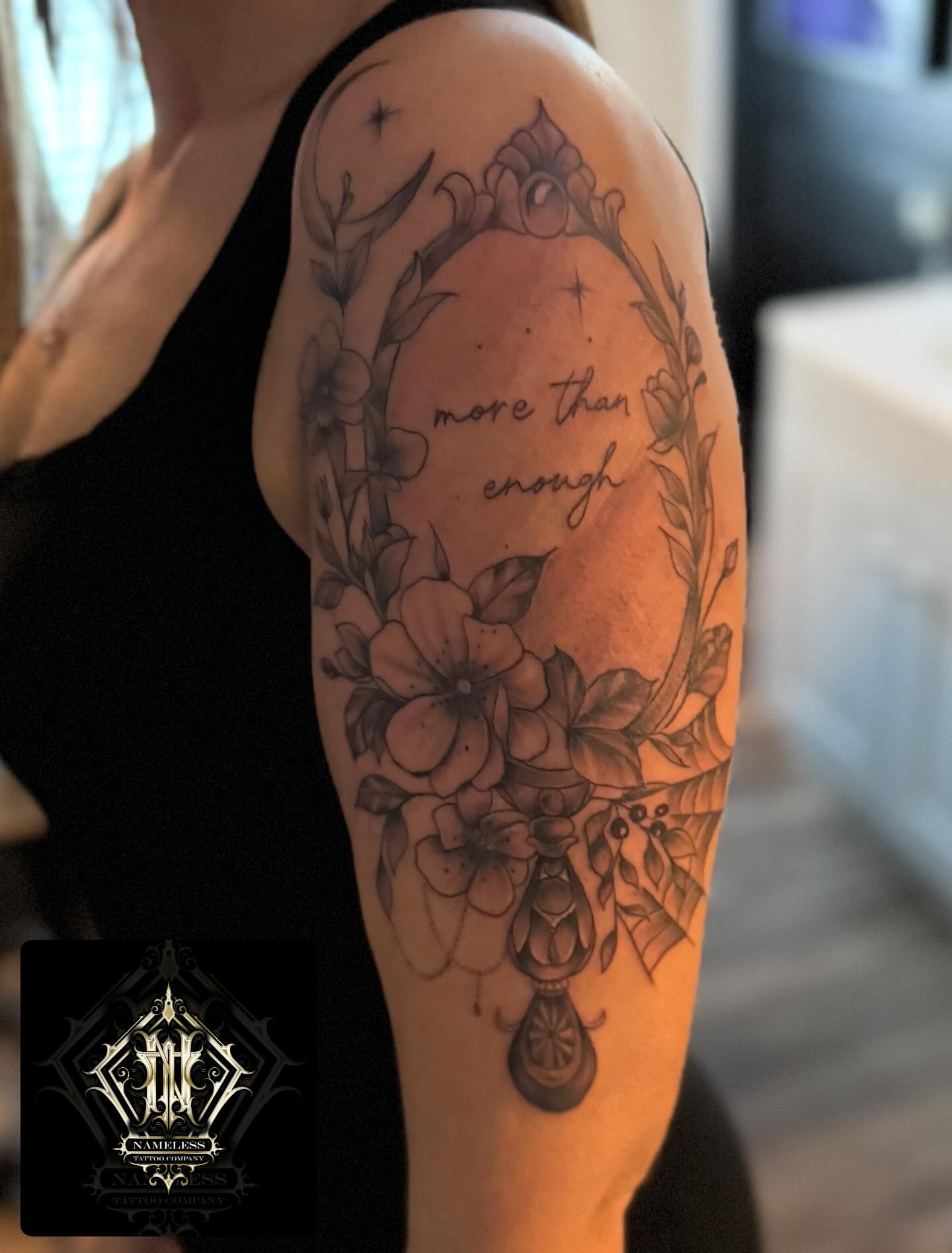 Cherry blossoms and floral wreath ornamental tattoo on the forearm by AJ