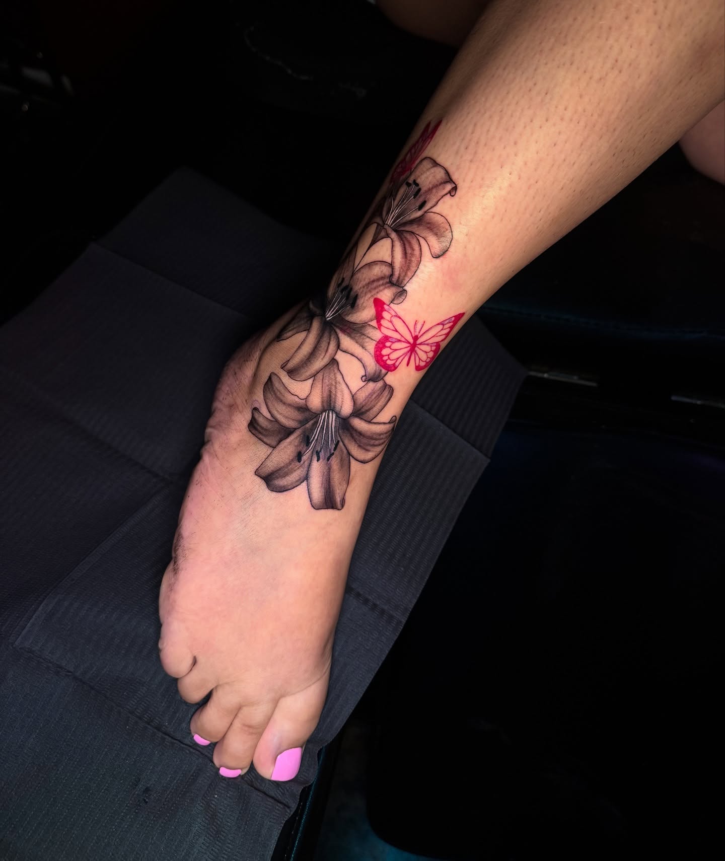 Lilies and butterfly realism tattoo on the foot by Austin Tattoo Artist💉