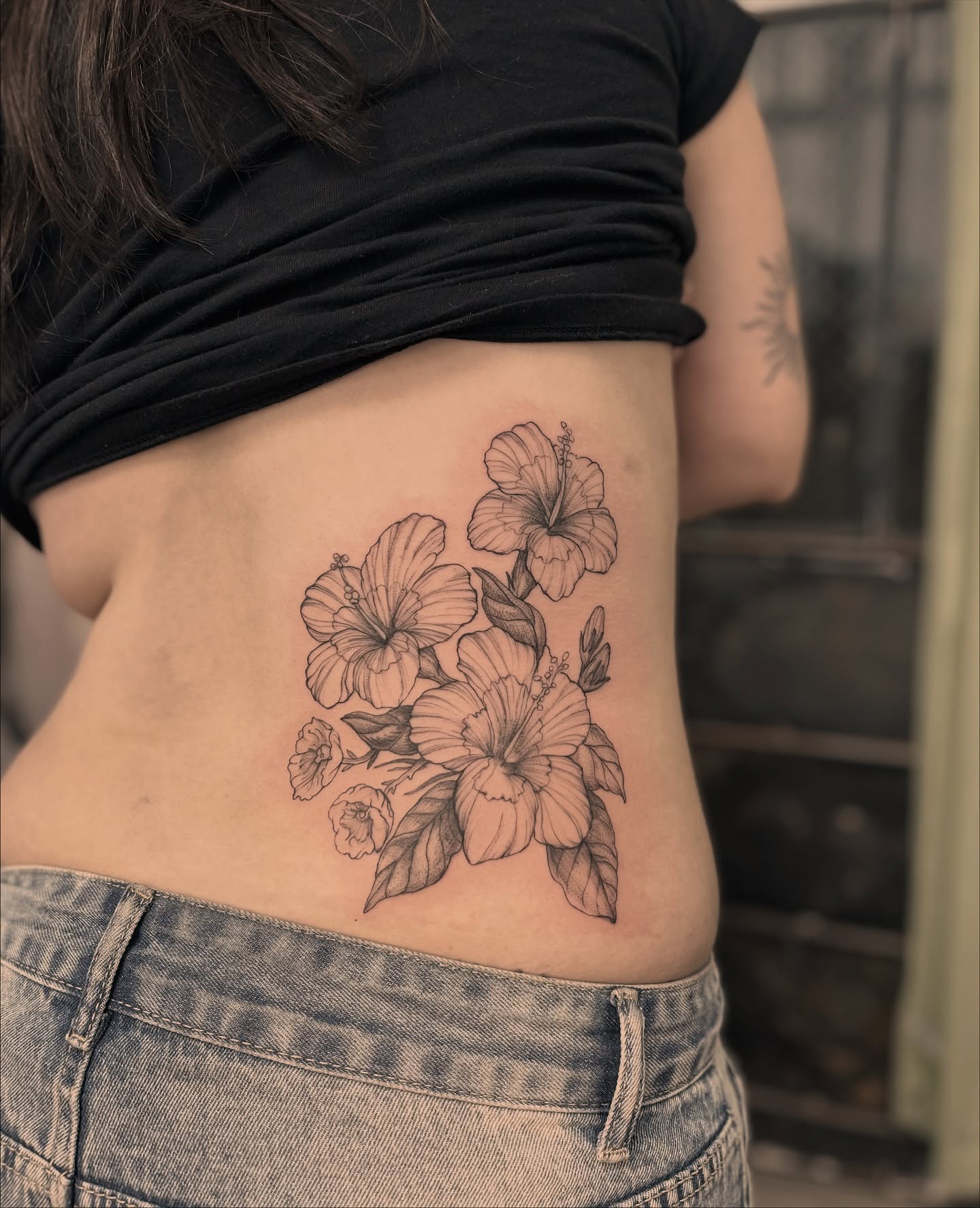 Hibiscus flowers black and grey tattoo on the ribs by Ying Xeon