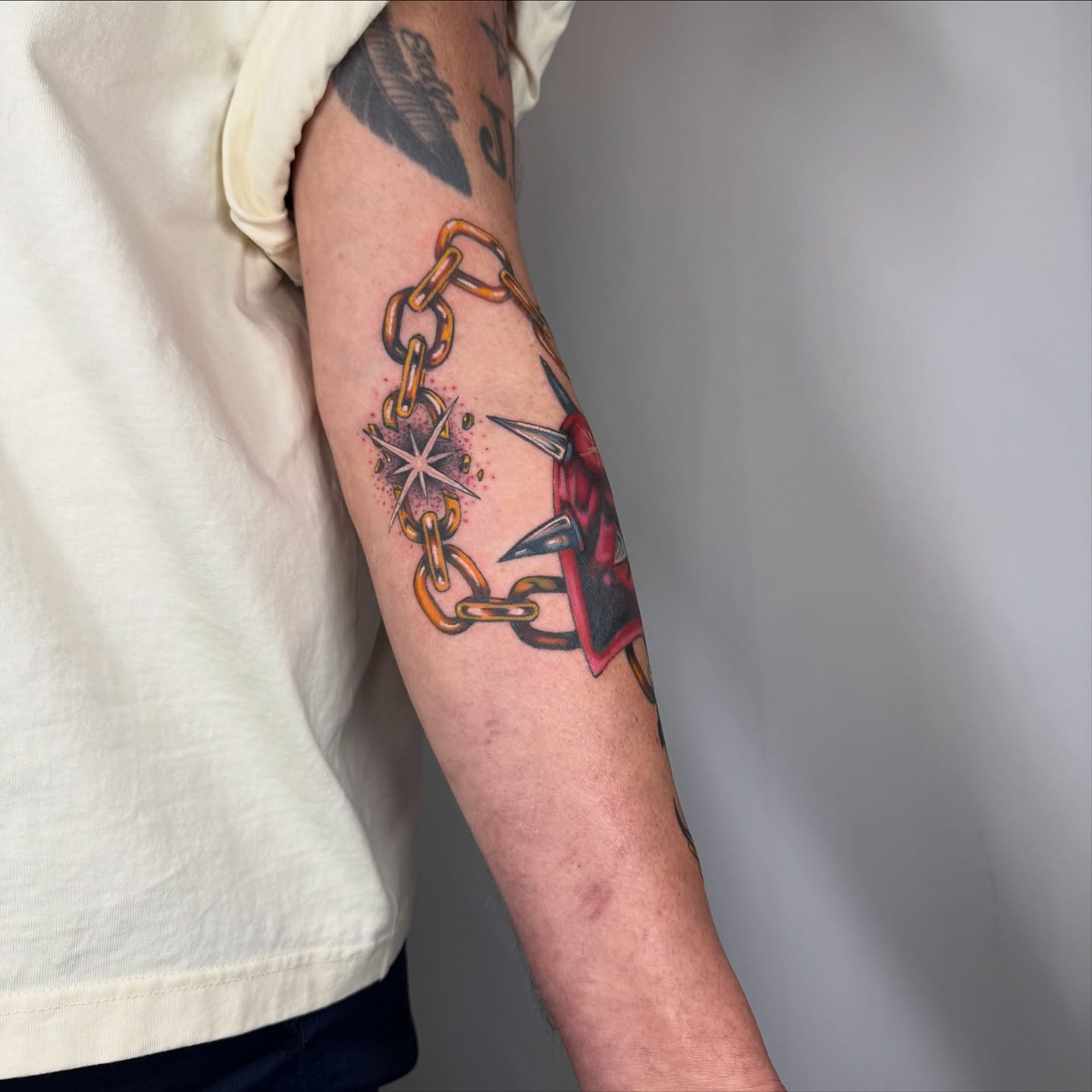 Chains and dagger neo-traditional tattoo on the forearm by Franky A Bonifacio, Seattle, Washington