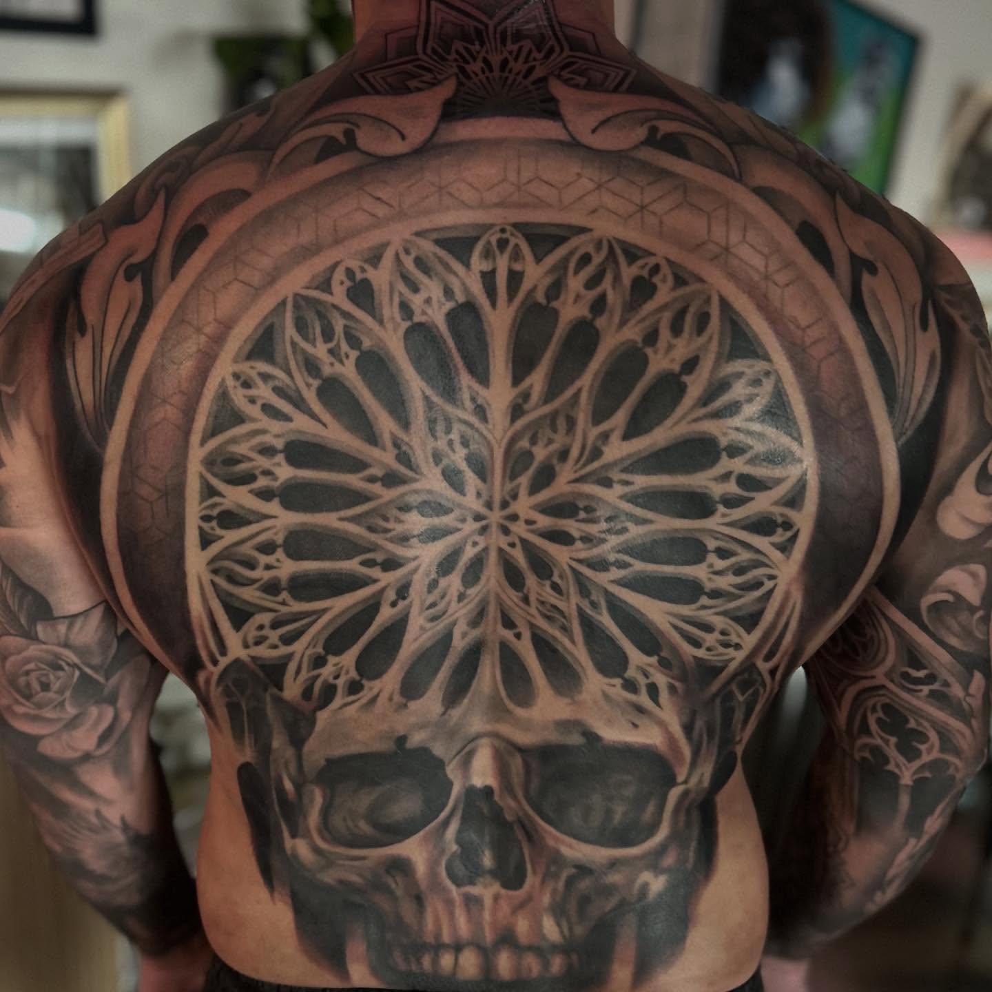 Skull geometric tattoo on the back by Whitney Harbin