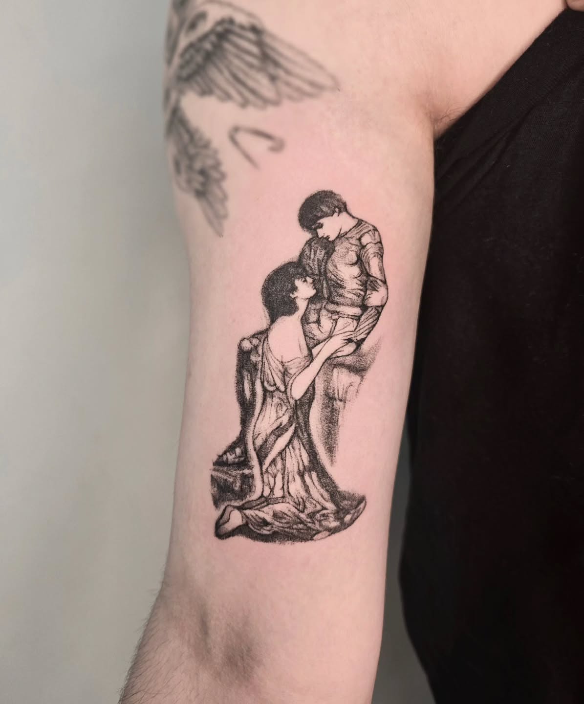 Couple embracing realism tattoo on the forearm by Vintage tattoo