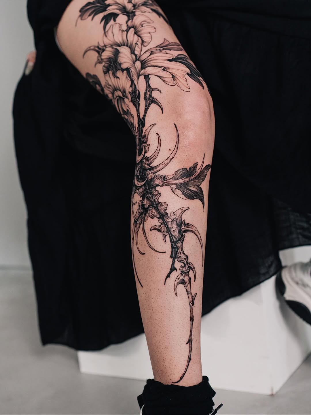 Tattoo by @siio_ink — black_and_grey, dark_realism