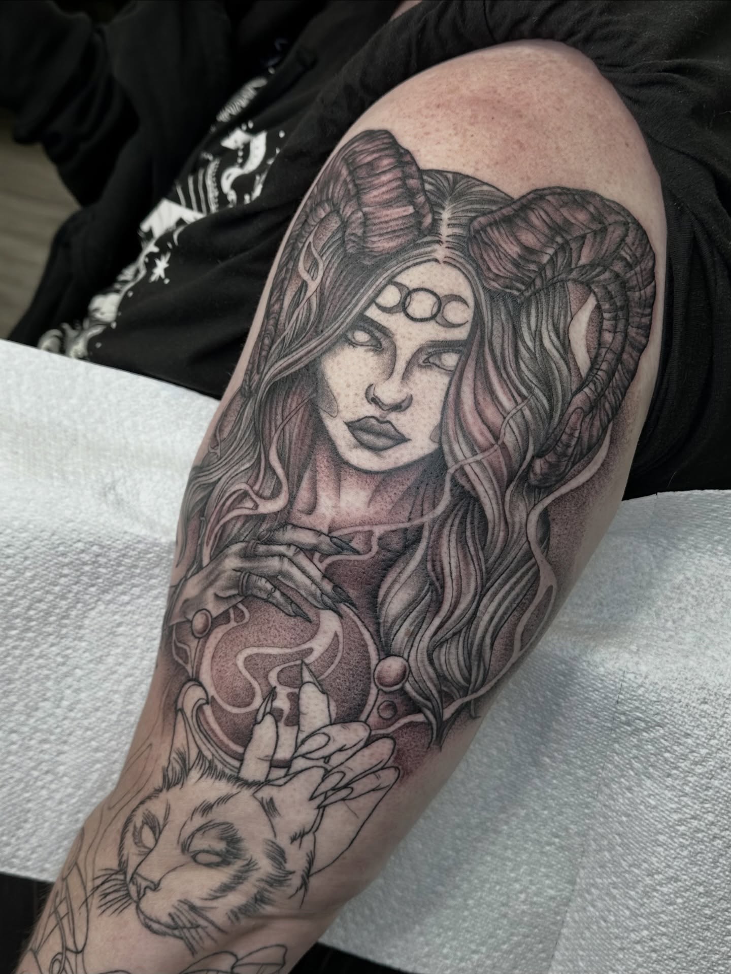 Woman with ram horns realism tattoo on the forearm by hannah vertal