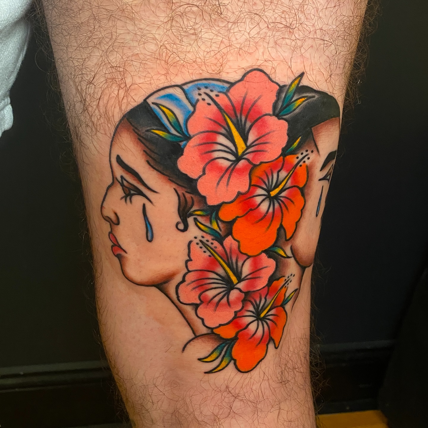Woman with flowers American traditional tattoo on the forearm by Marcos🇩🇴