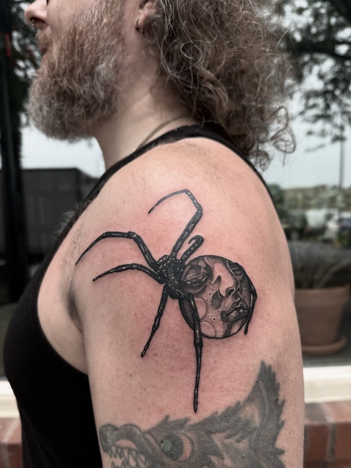 Spider and moon realism tattoo on the shoulder by Danielle