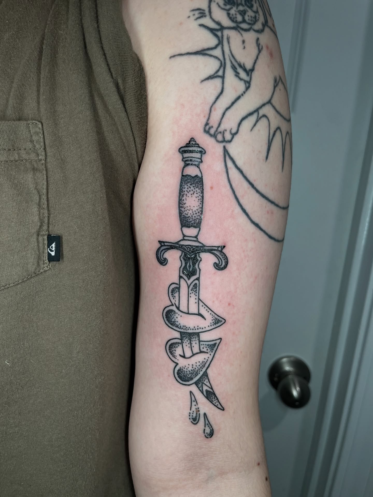 Sword dotwork tattoo on the forearm by layne
